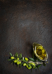  Olive oil and branch of olive tree.