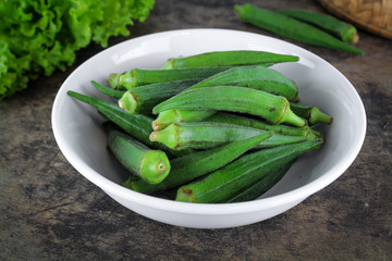 fresh whole and slice organic green okra, healthy vegetable