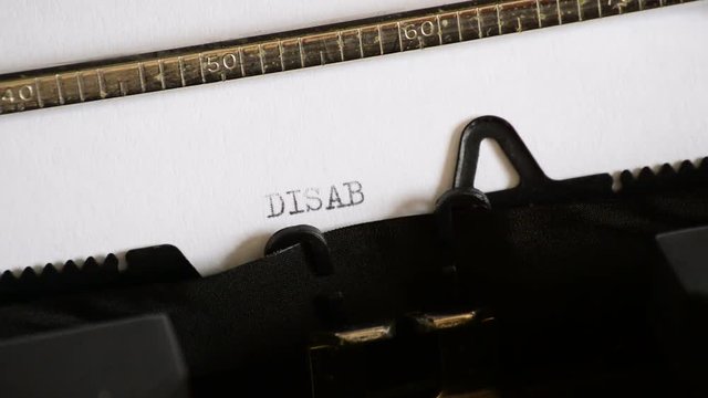 Typing the word DISABLED with a old manual typewriter