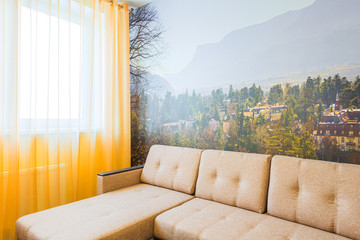 The interior of the living room in orange tones with sofa