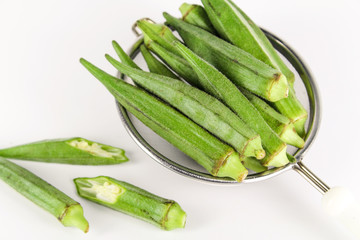 fresh whole and slice organic green okra, healthy vegetable