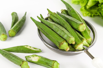 fresh whole and slice organic green okra, healthy vegetable
