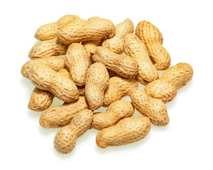 Pile of dry roasted peanuts isolated on white background. Closeup.
