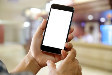 Man using Smartphone with Blurred Hospital background