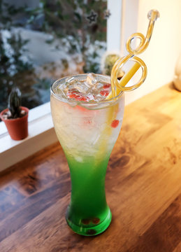 green soda with ice
