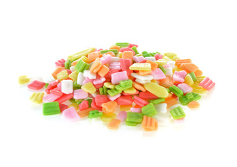 Sugar sprinkles on top of icing birthday cake.