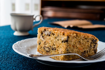 Carrot Cake with walnut, cinnamon and cup of tea or coffee