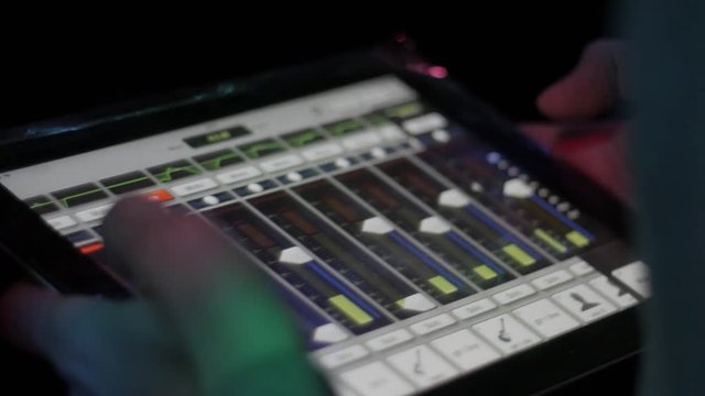 man with mixing console on tablet check sound on event, music, technology, people and equipment concept