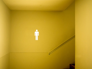 Male toilet sign in building