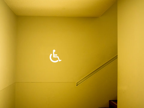 Disabled sign in building