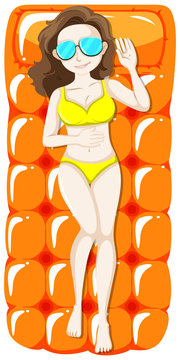 Woman in yellow bikini on floating mat
