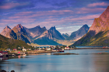 Panoramic view of the fishing village of Reine with dramatic sky.  Rocky beach, Lofoten islands, Norway