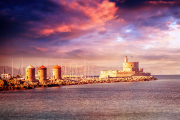 Beautiful seascape. Sunset at the port in the old town of Rhodes