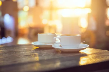 Poster Im Rahmen Kaffee am Morgen, zwei Tassen Espresso auf Holztisch im Café oder Coffeeshop. © Quality Stock Arts