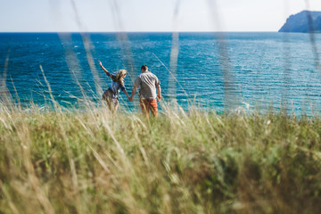 Enjoying the freedom of the sea and wind in hair. Happy couple together