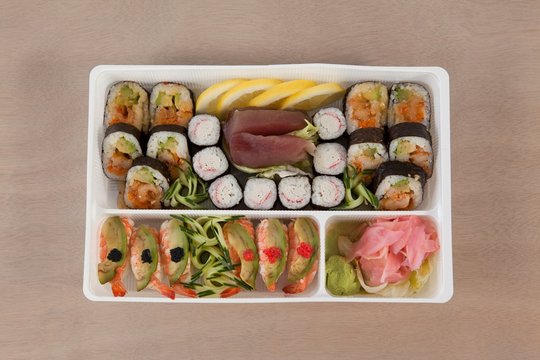Set of assorted sushi kept in a white box