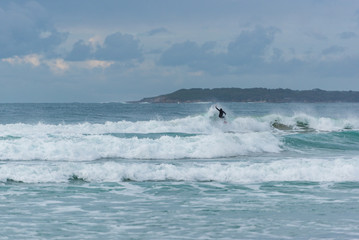 Stormy weather with high waves and grey sky