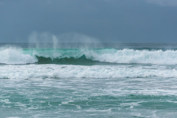 Fototapeta premium Stormy weather with high waves and grey sky