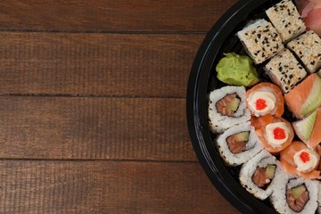 Set of assorted sushi kept in a black round box