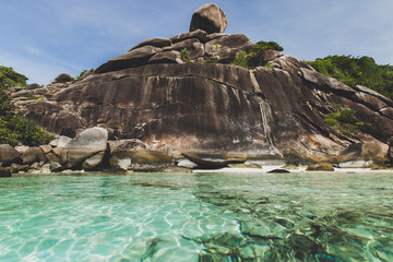 Rocky coast of paradise island with transparent crystal and clear water