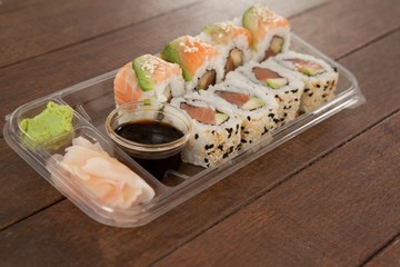Set of assorted sushi served in a plastic box