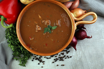 Tasty Hungarian beef goulash soup bograch close-up on the table