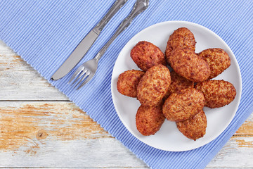 juicy delicious meat cutlets on white plate