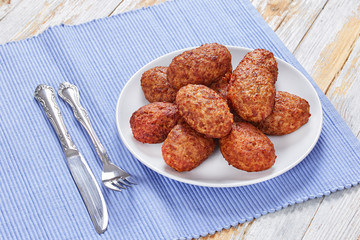 juicy delicious meat cutlets on white plate