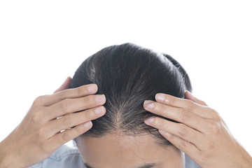 Fototapeta premium Young woman shows her gray hair roots
