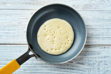 Preparation of pancakes on pan, top view