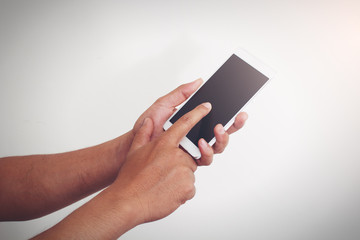 Man holding his mobile phone and pointing to find his business connection with cross processing on instagram like.