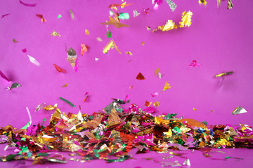 Colorful confetti on color background