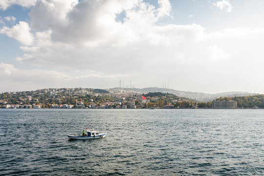Boat at Bosphorus channel, connecting Europe and Asia, Istanbul, Turkey.