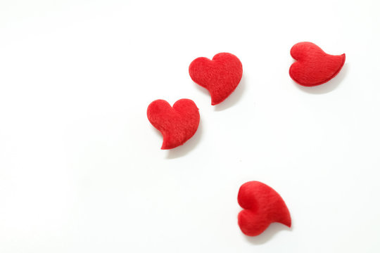 The four red hearts for Valentine's Day decorations. On a white background