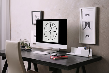Workplace with computer on table in modern room