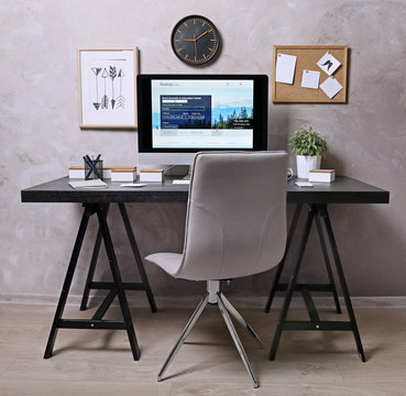 Workplace with computer on table in modern room