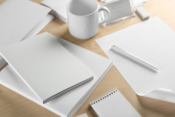 Blank office supplies on wooden background