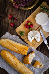 Cheese, radish, grapes and baguette