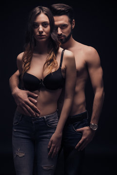 sexy young couple intimate, looking at camera, bra shirtless jea