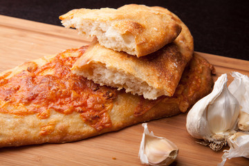 Fresh homemade bread, ciabatta with cheese and garlic