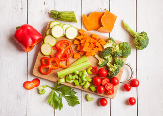 Various cut vegetables on cutting board