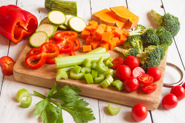 Various cut vegetables on cutting board