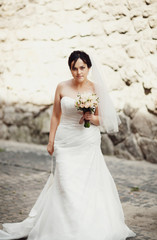 Bride in the white dress with a bouquet