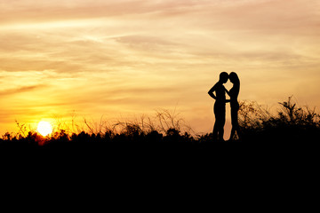 Romantic Couple at Sunset. Theme love of silhouette
