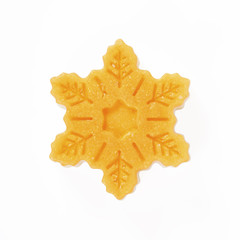 Handmade soap in the snowflake form is isolated on a white background