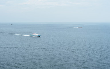 Obraz premium Three ships sailing in the sea.