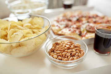 close up of fast food snacks and drink on table