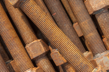 Close-up texture of old rusty screw nuts and bolts use for indus