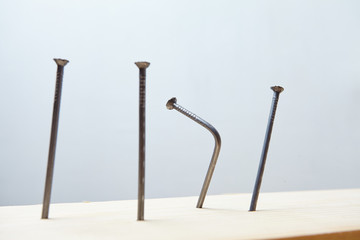 nails on the wood panel