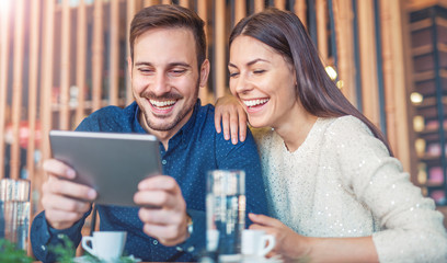 Young couple drinking coffee in a cafe. Dating, relationships, l